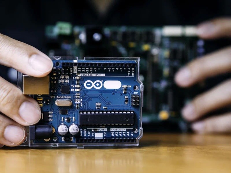 Engineer holding a development board