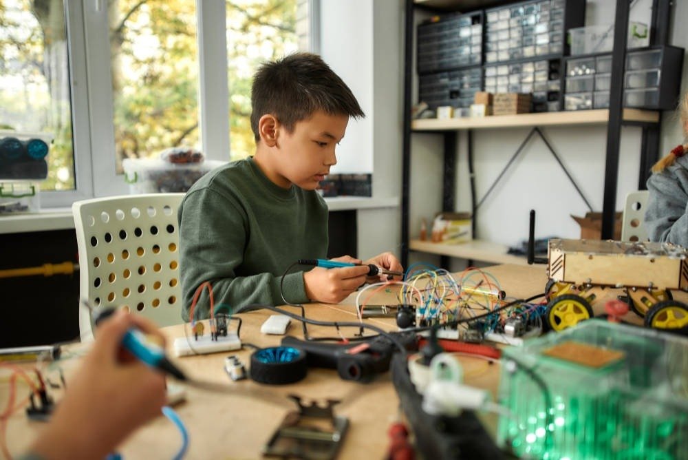 Young maker building electronics projects