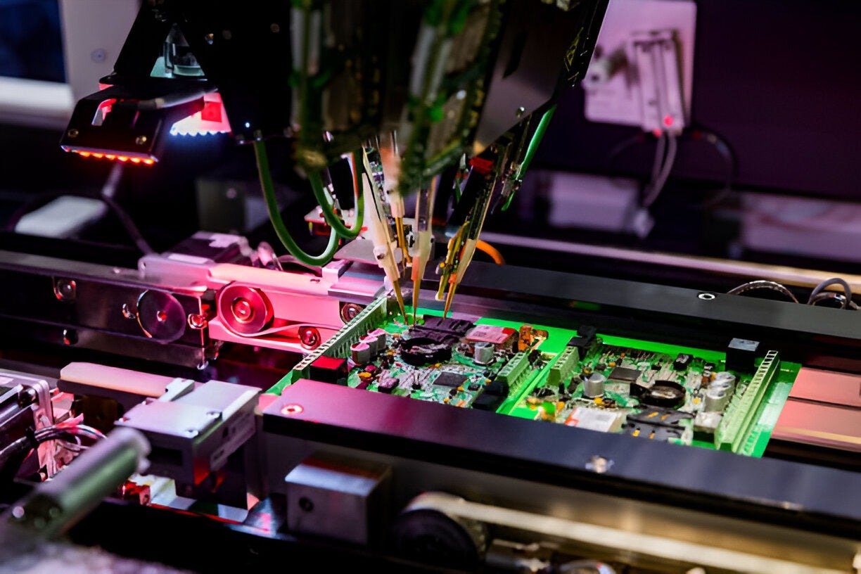 Automated PCB assembly machine placing components